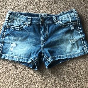 Silver distressed jean shorts